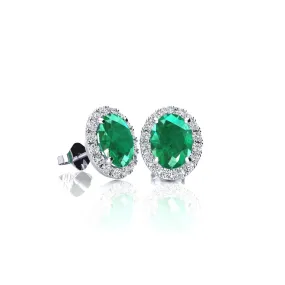 1 Carat Oval Shape Emerald And Halo Diamond Stud Earrings In 14 Karat White Gold